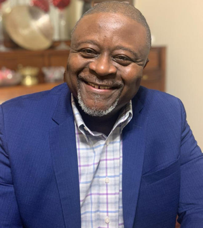 GUS DOE WILLIAMS
Member at Large